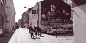 Tour group walking past the Black Box, Hill Street, Belfast